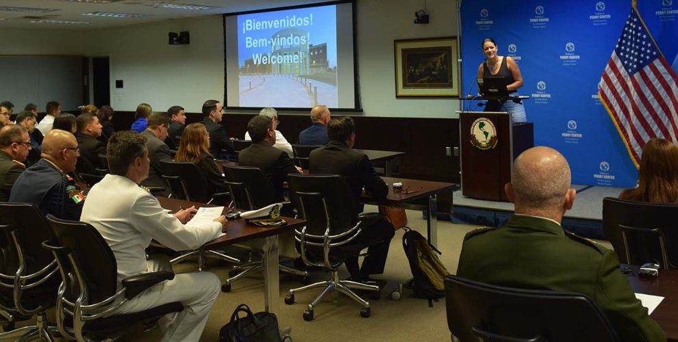 Operations Officer Maria Fernanda Martinez welcomes participants to the Perry Center